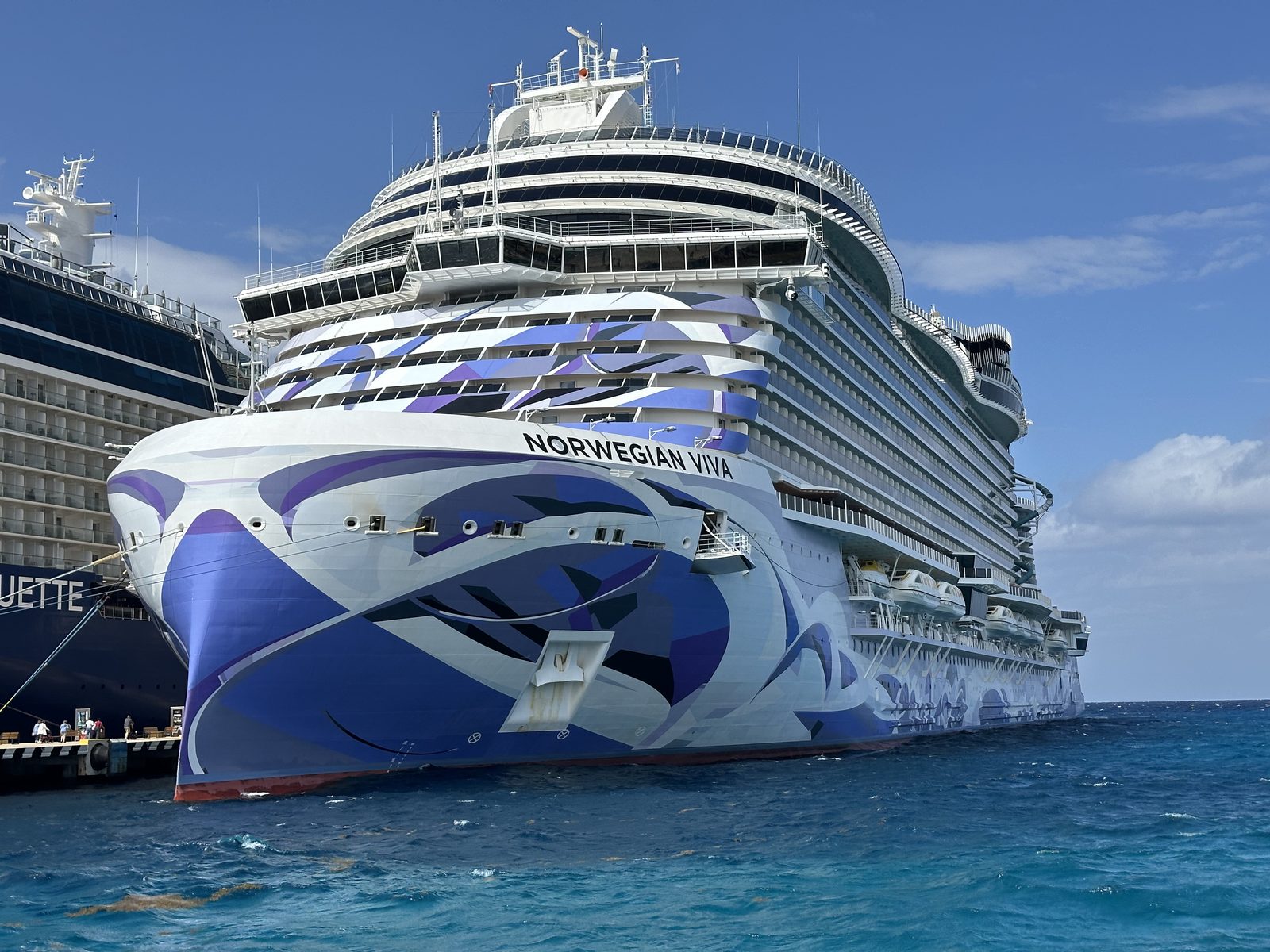 The bow of the Norwegian Viva at the pier in Cozumel, the Celebrity Silhouette moored alongside.