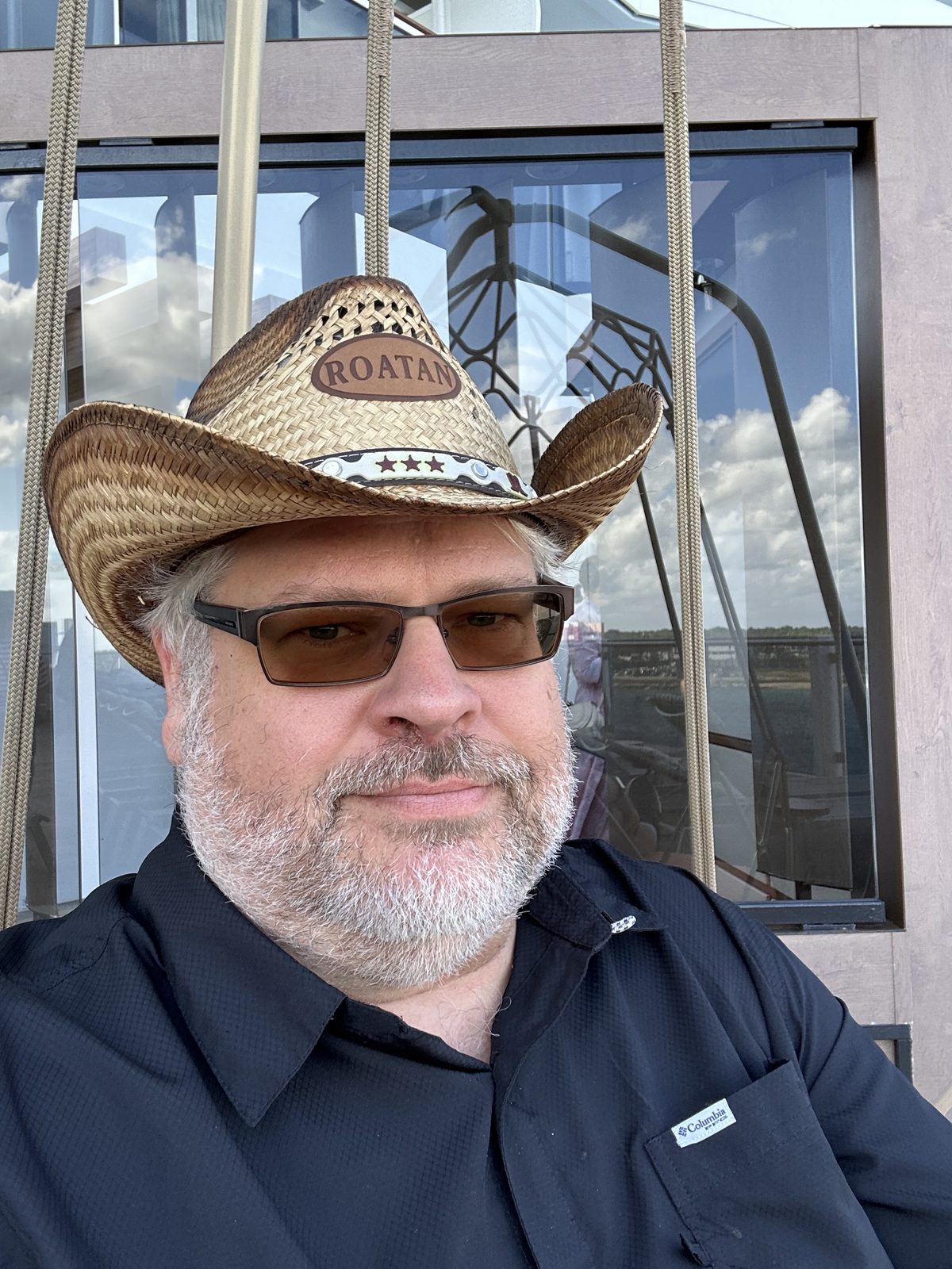 Ernie in the ROATAN hat and sunglasses, out on deck at Cozumel.